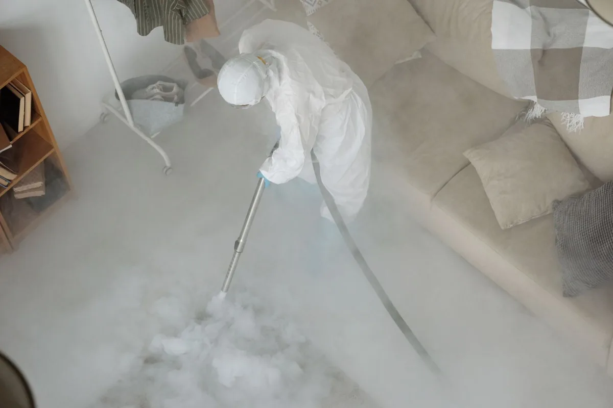 Biohazard cleanup technician in protective equipment, Menands, NY